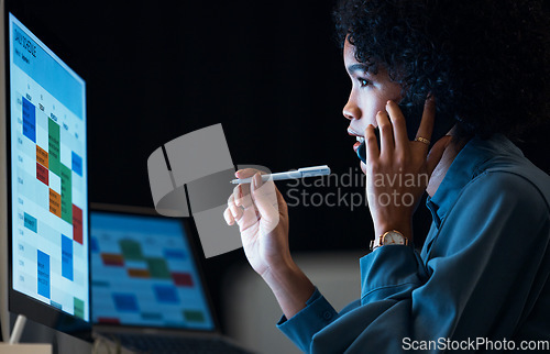 Image of Woman with computer, phone call and schedule in dark office for agenda, reminder and office administration. Online calendar, night and cellphone, girl at desk planning spreadsheet for time management