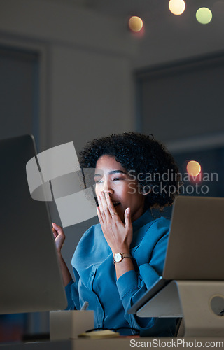 Image of Night, burnout and tired business woman yawning in office with computer and tablet for research. Working late, fatigue and sleepy female designer with low energy online for digital web design plan