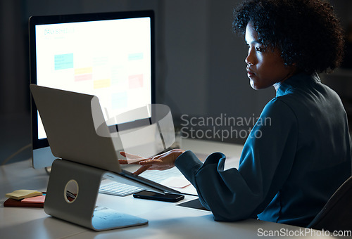 Image of Woman with laptop, night and checking schedule, agenda and reminder for office administration. Online calendar, diary and girl at dark desk planning spreadsheet for time management on computer screen