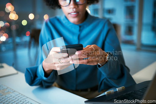 Image of Night, phone and hands of business woman in office with social media, text or chat communication. Working late, message and female entrepreneur with smartphone app for internet, search or reading