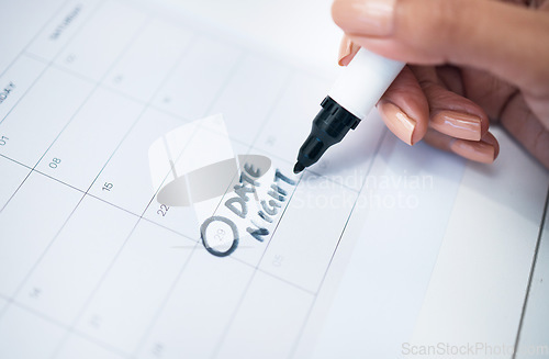 Image of Person, hand and marker on calendar for date, schedule planning or agender on paper on office desk. Closeup of woman writing daily plan, anniversary or tasks for reminder or memory at workplace