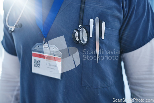 Image of Close up, doctor and medical utensils with stethoscope, morning sunrise and name tag. Healthcare, service professional and work for wellness, scrubs and worker for employee, surgeon and medicare