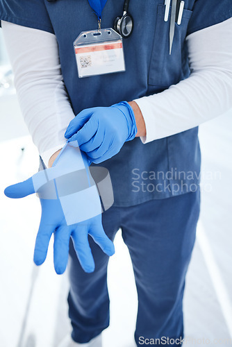 Image of Gloves, hospital and hands of doctor for medical service, surgery and working in clinic for wellness. Healthcare, help and person with ppe for safety, protection and hygiene for support or procedure