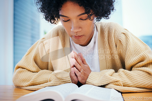 Image of Bible, prayer and woman in home for religion, Christian worship and reading to study. Person, holy book and meditation at desk for God, Jesus Christ and faith in spiritual gospel, praise and hope