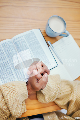 Image of Bible, notes and hands of woman in prayer at desk in home, Christian faith or knowledge of God from above. Reading, study and girl at table with holy book, learning gospel for inspiration or theology