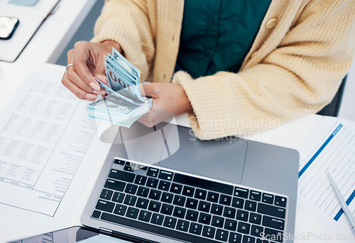 Image of Hands, laptop and a business person counting money closeup in the office of a bank for accounting. Cash, budget and trading with a financial advisor in the workplace for investment growth from above