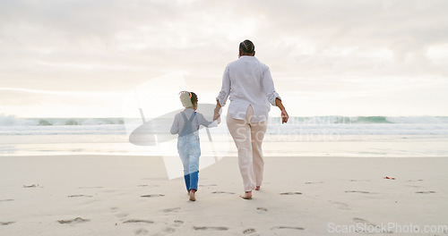 Image of Black family, mother and daughter holding hands, beach and bonding with love and care, back view and walk outdoor. Sea, freedom and travel, woman and girl on holiday with trust and support in nature