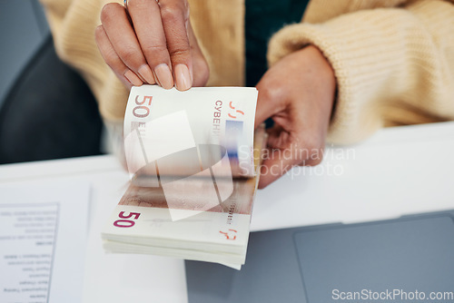 Image of Hands, economy and a business person counting money closeup in the office of a bank for accounting. Cash, budget and savings with a financial advisor closeup in the workplace for investment growth