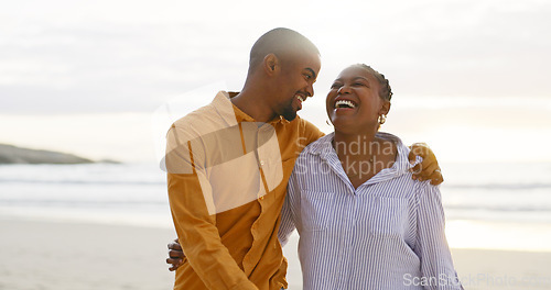 Image of African couple, beach and arm for walk with love in outdoor for quality time on vacation. Happiness, man and women with bonding with ocean for travel or holiday to relax are cheerful together.