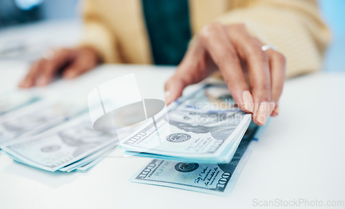 Image of Hands, financial and a business person counting money closeup in the office of a bank for accounting. Cash, budget and economy with a finance advisor closeup in the workplace for investment growth