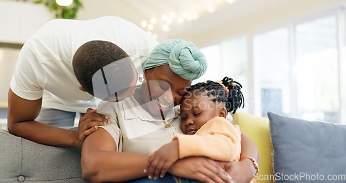 Image of Black family, relax and parents hug child on sofa at home for bonding, quality time and happiness. Love, lounge and happy mother, father and girl on couch embrace together for care in living room