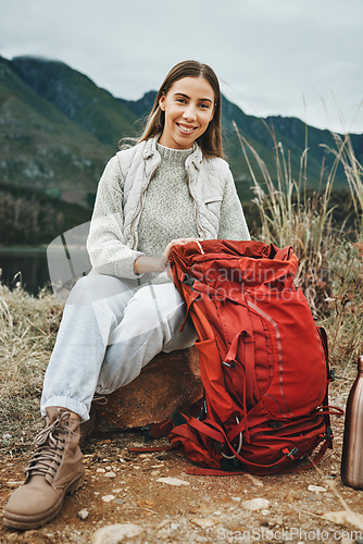Image of Nature, backpack and portrait of woman hiking on a mountain for adventure, weekend trip or vacation. Happy, bag and female person from Canada trekking and camping in an outdoor forest for holiday.