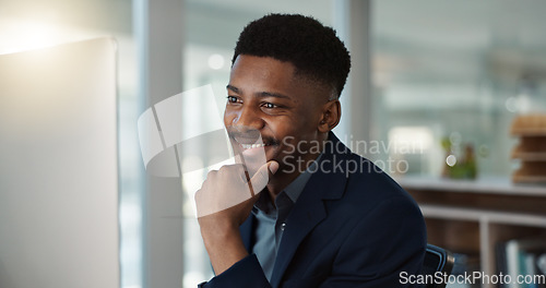 Image of Businessman, thinking and reading on computer with a smile in office for email, feedback or communication. Working, online or black man with research, inspiration or ideas from Nigeria report or news
