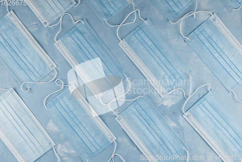 Image of Medical masks on the blue colored background