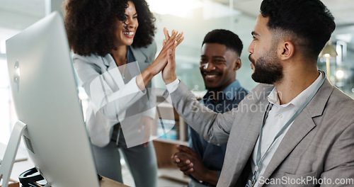 Image of People, team and collaboration in celebration at office for success, achievement or goal in project. Diverse group, congratulations and technology in digital marketing, sales or e commerce with staff