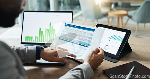 Image of Hands, laptop and chart with paper for business man, analysis or check progress of economy, investment or profit. Financial agent, pc and reading graph for data document, growth or numbers for future