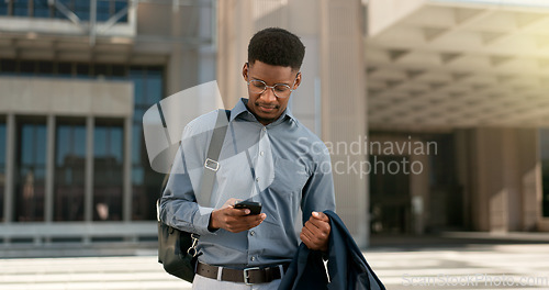 Image of Man, walking and texting from work, corporate clothes and wondering in city, buildings and outside. Professional, employee and leaving on social media, communicating and thinking of day, text or post