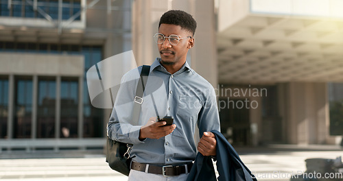 Image of Man, walking and texting from work, corporate clothes and wondering in city, buildings and outside. Professional, employee and leaving on social media, communicating and thinking of day, text or post