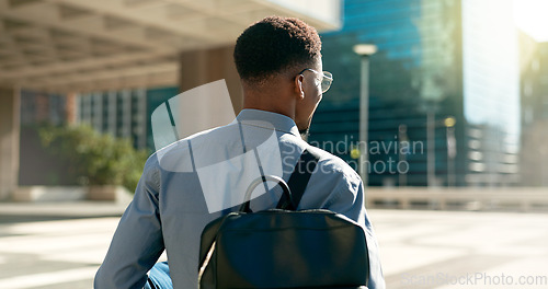 Image of City, back and business person walking on outdoor urban journey, commute and businessman on way to office building. Backpack, morning and professional agent on morning travel to work in Chicago, USA