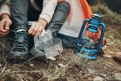 Image of Shoes, hands tie shoelace and camping, person outdoor in nature for travel and adventure, explore and lamp. Boots, hiking with start or prepare for walk, trekking and journey with health and fitness