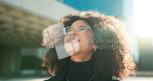 Image of Face, vision and wind with a business black woman in the city for growth, opportunity or inspiration. Thinking, street and smile with a happy young employee looking around an urban town for ideas