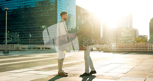 Image of Teamwork, greeting or business people shaking hands in city for project agreement or b2b deal. Hiring, outdoor handshake or men meeting for a negotiation, offer or partnership opportunity on rooftop