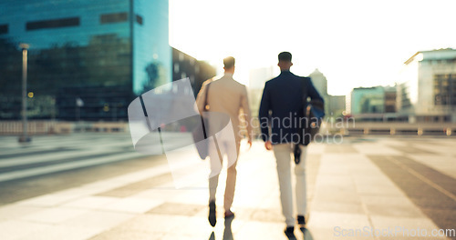 Image of Men, colleagues and talking outside in corporate clothes, advice or career growth tips. Planning, teamwork and city buildings on commute, discussion and businessmen for collaboration, project or goal
