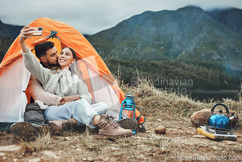 Image of Couple, tent and kiss in camping selfie, memory and holiday on web blog, morning and countryside. Man, woman and relax with vacation, social network post and adventure with love, outdoor and freedom