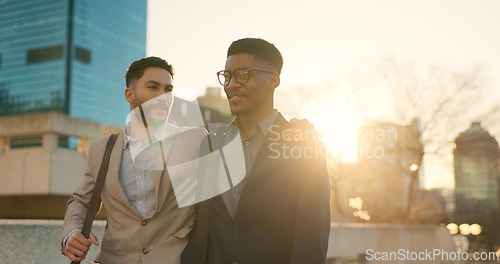 Image of City, men and walking with business people, hug and lens flare with professional, speaking and cooperation. Staff, outdoor and embrace with partnership, travel and conversation with support and ideas