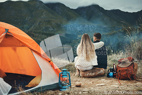 Image of Couple, hug and relax on mountain camping, adventure or travel in nature and environment. People, tent and bonding together with embrace, support or care and tent in forest and backpacking in woods