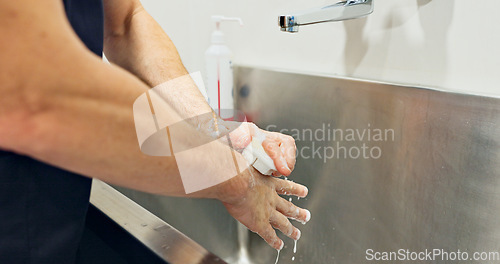 Image of Doctor, washing hands and soap by scrub for surgery for operation, hygiene and disease. Person, surgeon and closeup for preparation, clean or protection in medicine for healthcare, hospital or clinic