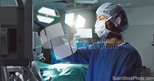 Image of Hospital, doctor and patient monitor for surgery, operating room and setting machine. Operation, medical or diagnosis for high blood pressure, vital signs and data change in anesthesia, type or check
