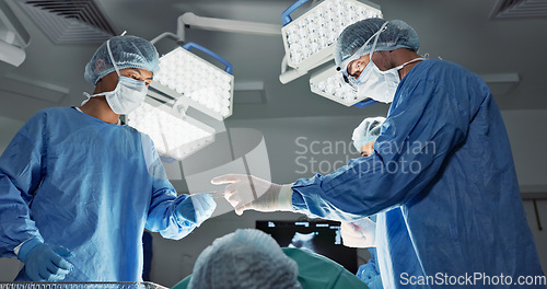 Image of Doctors, team or scissors for surgery in theater with medical support, healthcare or operation at hospital. Surgeon, medicine and teamwork or collaboration with tools for cardiology or emergency help