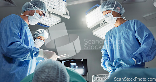 Image of Doctors, team or scissors for surgery in theater with medical support, healthcare or operation at hospital. Surgeon, medicine and teamwork or collaboration with tools for cardiology or emergency help