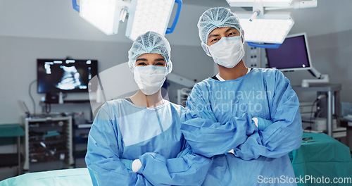 Image of Team, doctor and arms crossed with mask of professional in ICU for surgery, healthcare or procedure at hospital. Medical surgeon people in confidence, expert or teamwork for emergency care at clinic