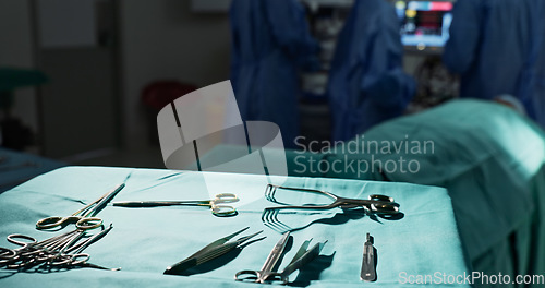 Image of Surgery, health and tools in operation theatre, help in medicine with treatment and closeup of equipment on table. Metal, medical and surgical instrument with doctor people at hospital for healthcare