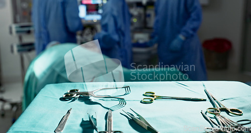 Image of Surgery, health and tools in operation theatre, help in medicine with treatment and closeup of equipment on table. Metal, medical and surgical instrument with doctor people at hospital for healthcare