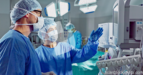 Image of Hospital, doctor and patient monitor for surgery, operating room and setting machine. Operation, medical or diagnosis for high blood pressure, vital signs and data change in anesthesia, type or check