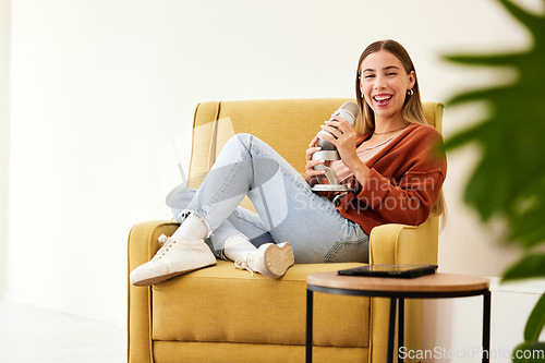 Image of Microphone, production and happy woman hosting podcast on a chair by a wall in her modern home. Radio, broadcast and young female person hosting a journalism talk show in a recording space at house.