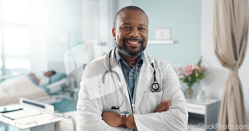 Image of Medicine, doctor and black man with arms crossed at hospital with smile for support, service and wellness. Healthcare, professional and African expert with happiness and pride for career and surgery