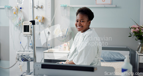 Image of Patient, hospital and happy on bed with recovery, illness and accept diagnosis with treatment plan. Black woman, healthcare and wellness in medical center, bedroom and smiling for doctor and therapy