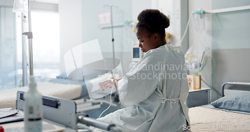 Image of Patient, hospital and thinking black woman after medical surgery for healthcare service, assessment or treatment. Consultation, medicine and sick person is sad in a clinic for health and depressed