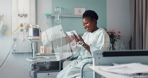 Image of Woman, reading card and bed in hospital for message, get well soon or motivation with smile, hope and recovery. Patient, excited and gratitude for kindness, love or quote with gift for rehabilitation