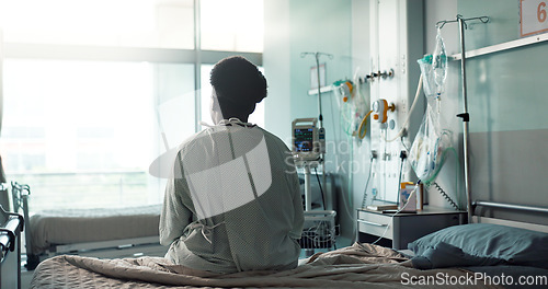 Image of Patient, hospital and sitting on bed with sad, depression and worry for heart disease diagnosis. Black person, treatment and healthcare in medical center, heart monitor and emergency with therapy