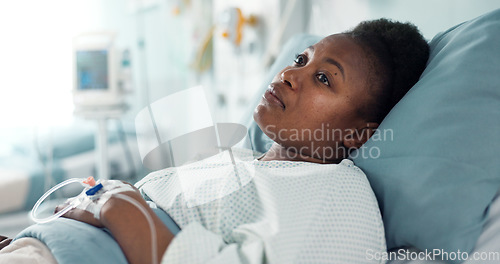 Image of Sad, sick and a thinking black woman in a hospital bed for healthcare, exam and a surgery. Tired, depression and an African clinic patient in a ward for treatment help, mental health or a virus