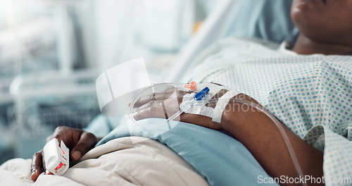 Image of Patient hand, bed and drip in closeup, hospital or treatment for hydration, liquid or supplement. Person, healthcare and wellness with blood transfusion, anesthesia or pharma drugs for pain in clinic