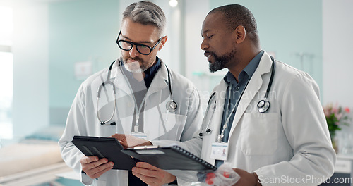 Image of Doctors, men and tablet for team discussion, planning and advice with innovation, research or problem solving. Diversity, medical partnership and talk with notebook, digital touchscreen and report