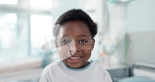 Image of Face, smile and a boy child patient in the hospital to visit a pediatrician for healthcare or a medical checkup. Portrait, medicine and a happy young african kid in a clinic for treatment or cure