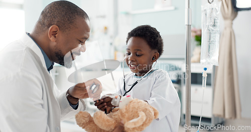 Image of Doctor, African kid and stethoscope for teddy bear, smile or play for recovery from surgery, game or breathing. Child patient, medic and boy with toys, talk or consulting for rehabilitation in clinic