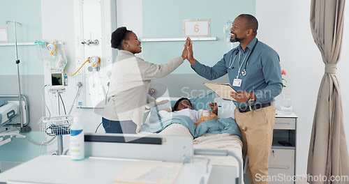 Image of Pediatrician, high five and parent with child in hospital for healthcare consultation in a clinic for health assessment. Medicine, success and mom love kid with care, support and doctor winning